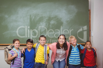 Students standing in front of blackboard