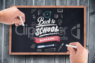 Composite image of business man writing with chalk