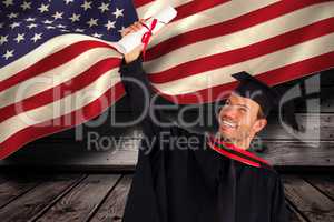 Composite image of happy attractive boy celebrating his graduati