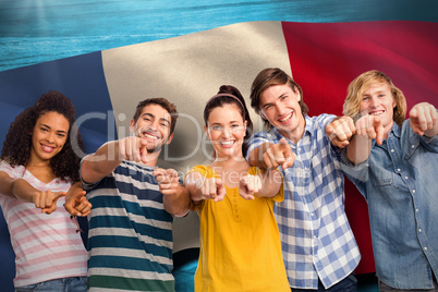 Composite image of college students pointing at camera