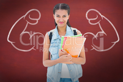 Composite image of student holding notebooks