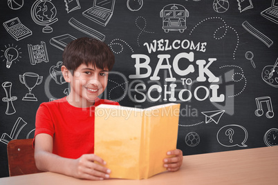 Composite image of portrait of boy reading book in library