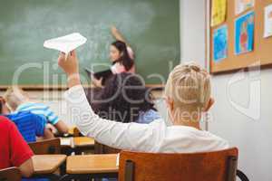 Student about to throw a paper airplane