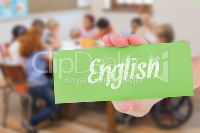 English against pretty teacher helping pupils in classroom