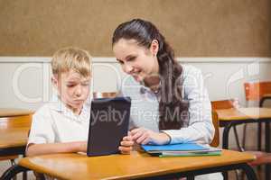 Teacher helping a student in class