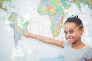 Student pointing to a map of the world