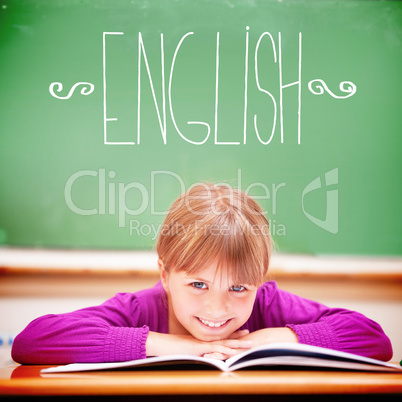 English against cute pupil sitting at desk