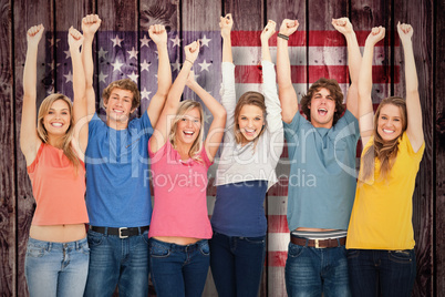 Composite image of smiling people raising hands up in the air