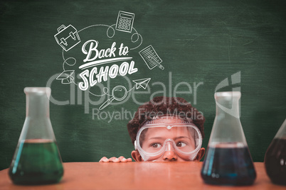 Composite image of cute pupil dressed up as scientist