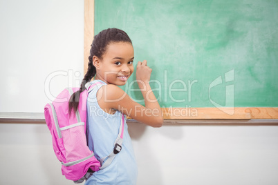 Smiling student wearing a school bag