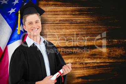 Composite image of a smiling man with a degree in hand as he loo