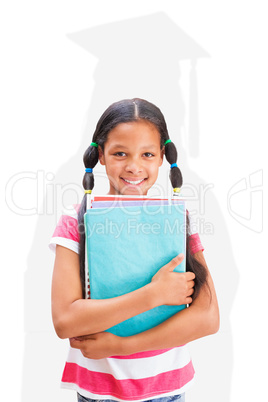 Composite image of cute pupil smiling at camera in library