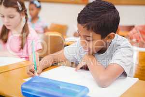 Pupil working at his desk