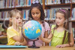 Pupils in library with globe