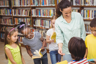 Pupils and teacher in the library