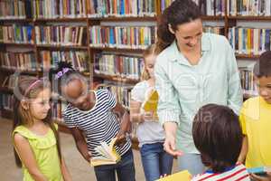 Pupils and teacher in the library