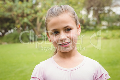 A Smiling kid standing outside