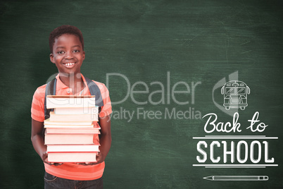 Composite image of cute little boy carrying books in library