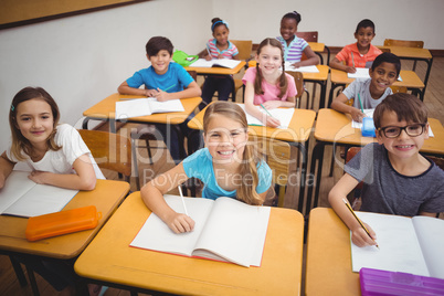 Happy pupils smiling at camera