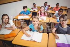 Happy pupils smiling at camera