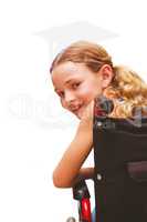 Composite image of portrait of cute girl sitting in wheelchair