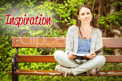 Inspiration against smiling student sitting on bench listening m