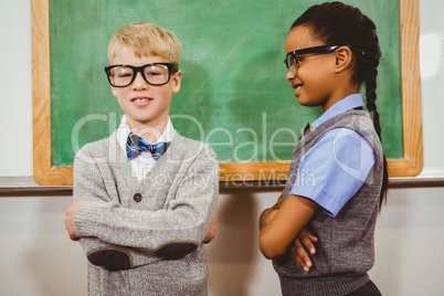 Smart students standing in front of a blackboard