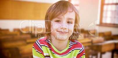 Composite image of happy little boy in the park