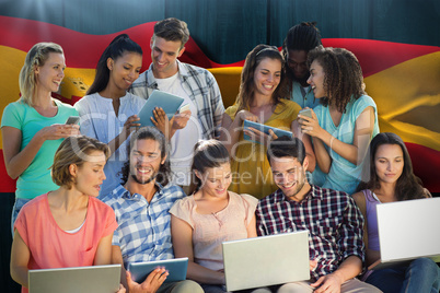 Composite image of several students using electronic devices