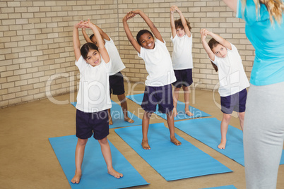 Happy students stretching out together