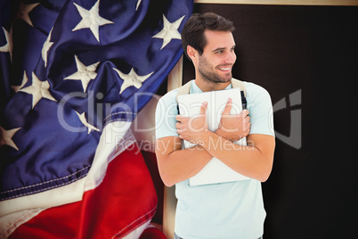 Composite image of student holding laptop