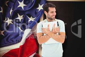 Composite image of student holding laptop