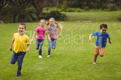 Cute pupils running towards camera