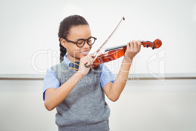 Student using a violin in class