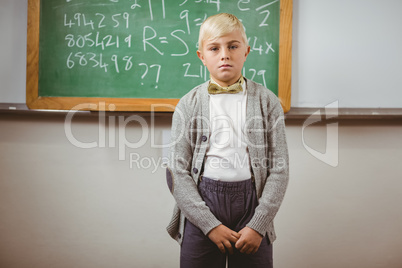 Pupil dressed up as teacher in front of chalkboard