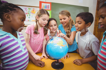 Teacher and pupils looking at globe Teacher and pupils looking at globe