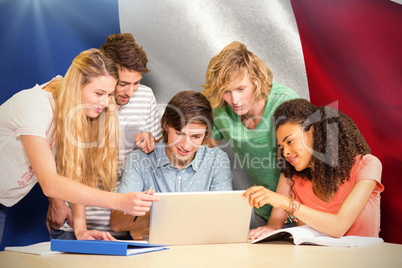 Composite image of college students using laptop in library