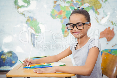 Smiling student doing class work