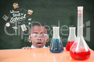 Composite image of pupil doing science experiment