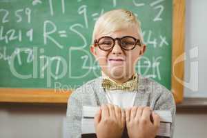 Pupil dressed up as teacher holding books