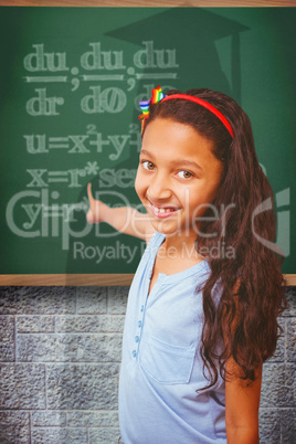 Composite image of happy pupil pointing