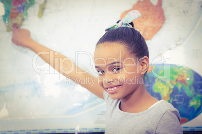 Student pointing to a map of the world