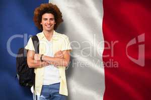 Composite image of young man with arms crossed in office corrido