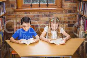 Students reading books while sitting down