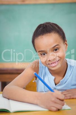 Smiling student working on school work