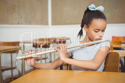 Student using a flute in class