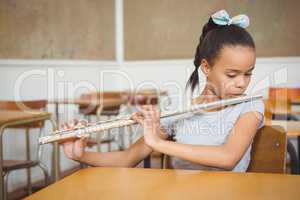 Student using a flute in class