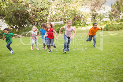 Children running on the grass
