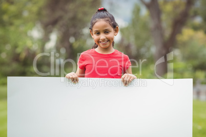 Cute pupils showing large poster