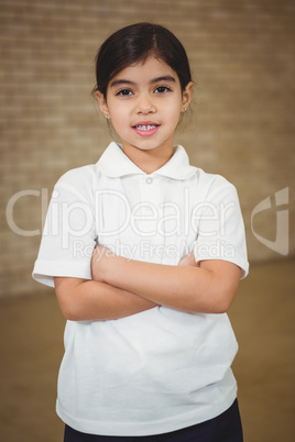 Happy pupil with folded arms